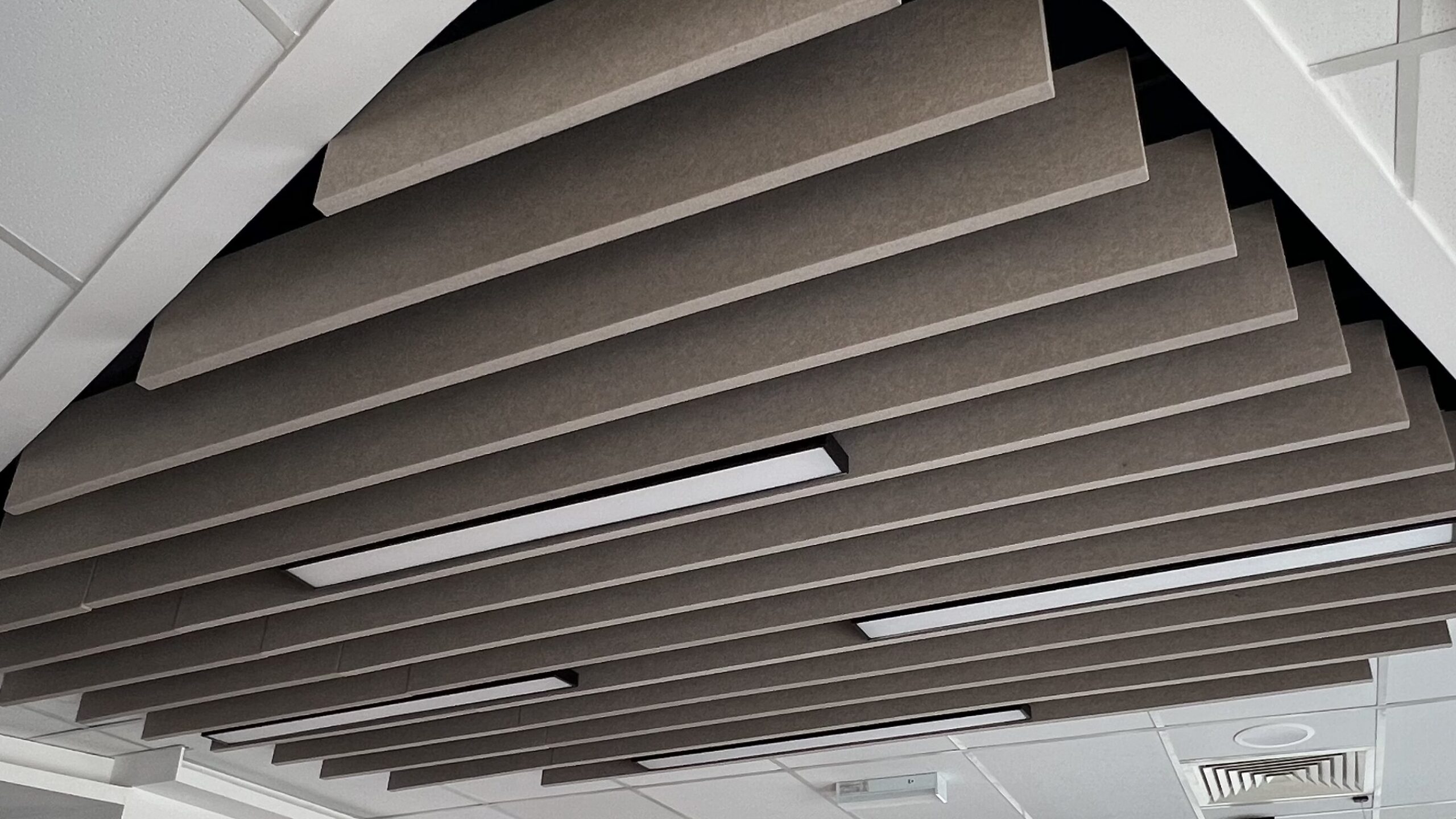 acoustic ceiling baffles for offices workstations co working space lobby walkway